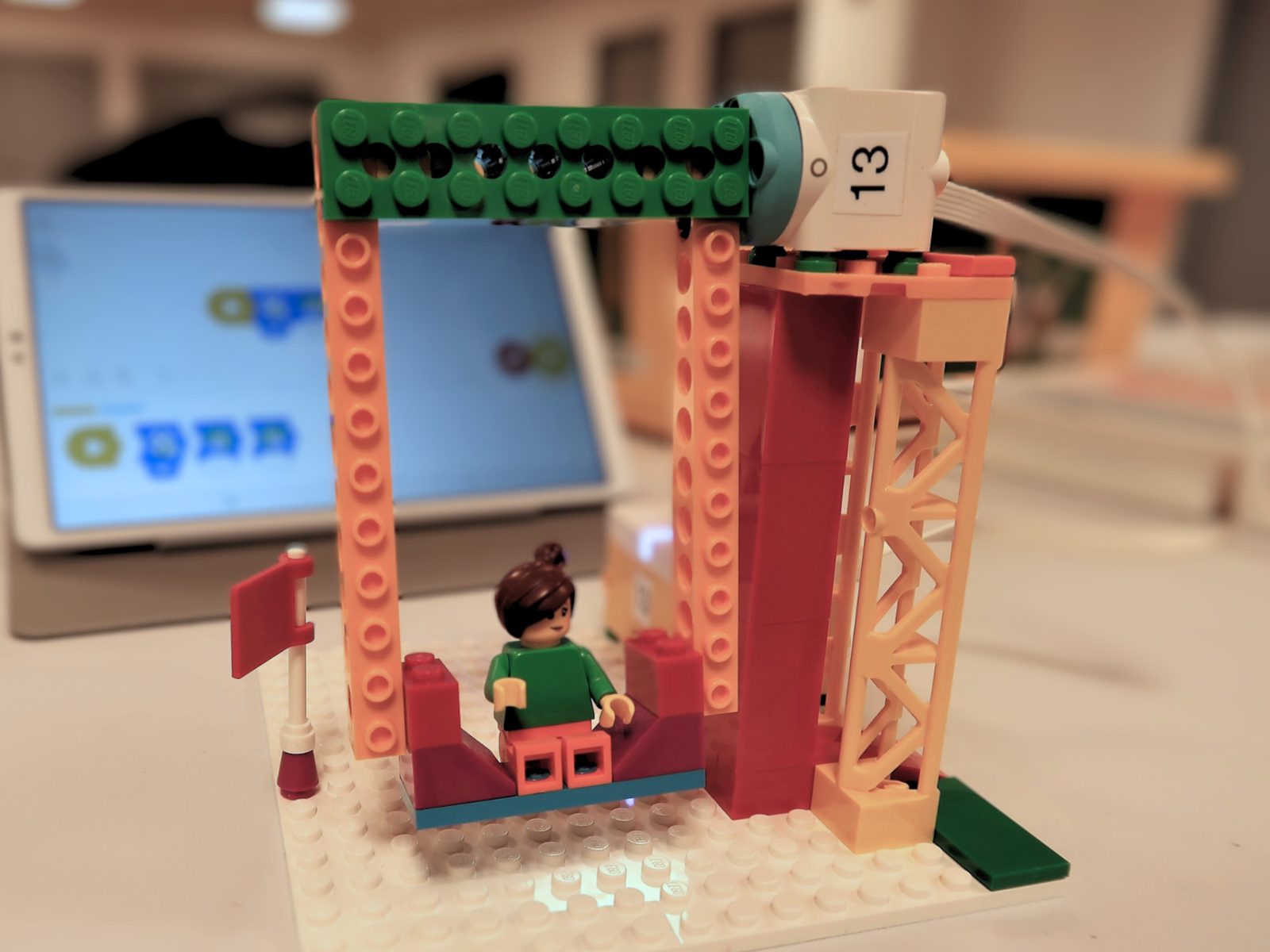 A LEGO swing ride built and programmed on a tablet
