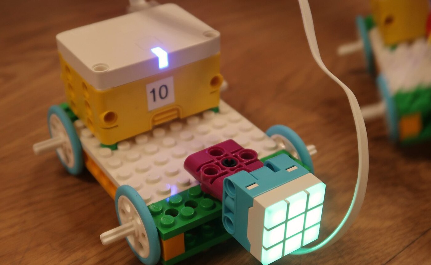 A LEGO robot car with a light-up sensor